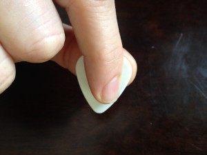 index finger holding pick